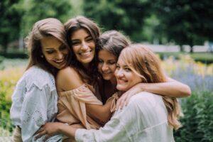 4 female friends hugging