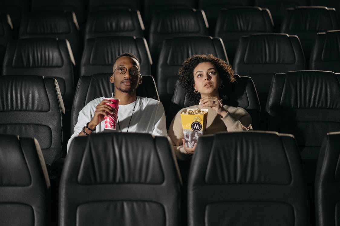2 people in movie theatre
