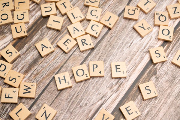 Scrabble tiles spelling HOPE in counselling